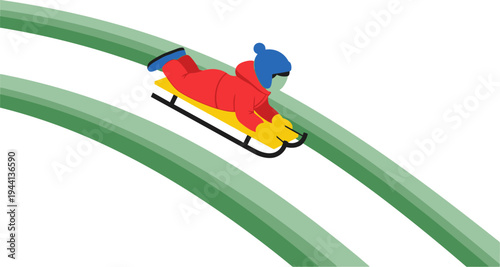 Young child slides down a curved green track on a yellow sled