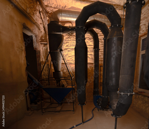 Pellet production in a factory. Heating a house with pellets. Pellet manufacturing process and its storage.