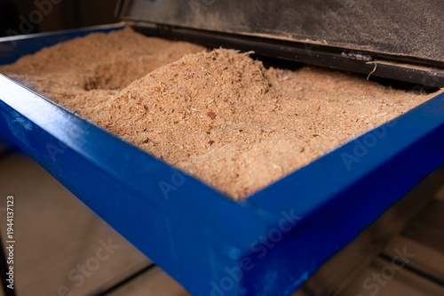 Pellet production in a factory. Heating a house with pellets. Pellet manufacturing process and its storage.