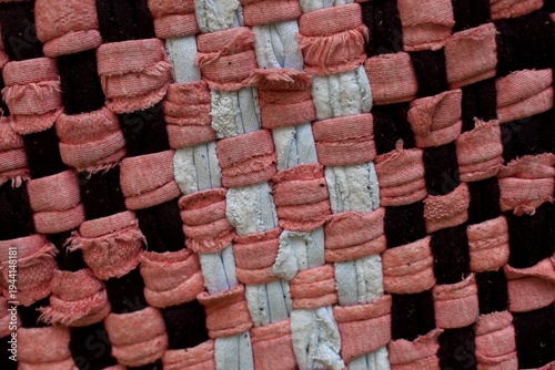 Close up view of the pattern and texture of the doormats fabric. 
Colorful woven fabric mat. Traditional texture, handcraft, textile background.