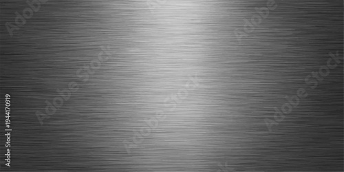 Shiny brushed metallic surface. An intriguing blend of light and shadow dances across it, creating a mesmerizing visual texture.