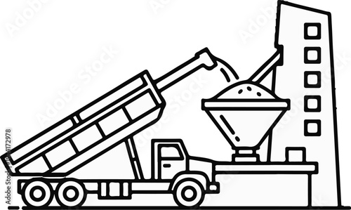 Construction truck dumping material into industrial plant hopper