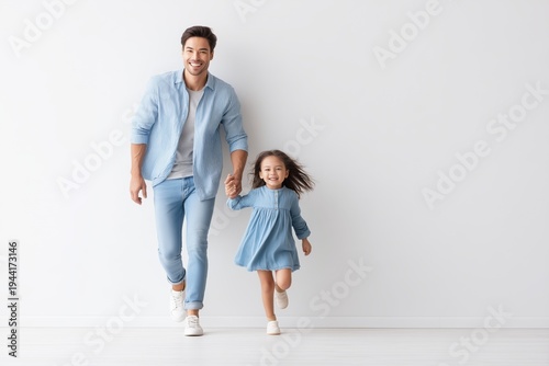 Happy Father and Daughter Running Together Holding Hands