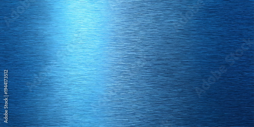 Abstract a textured blue metallic surface reflects a soft diagonal light, creating a gradient of shades and highlighting the brushed metal grain.