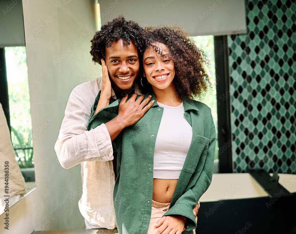 Obraz premium Portrait of a lovely young couple together, bonding hugging and relaxing at home