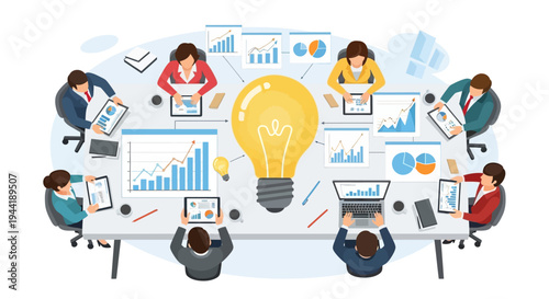 Business people sitting around table with laptops.