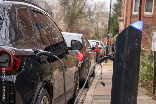 An electric car on-street charging on residential street