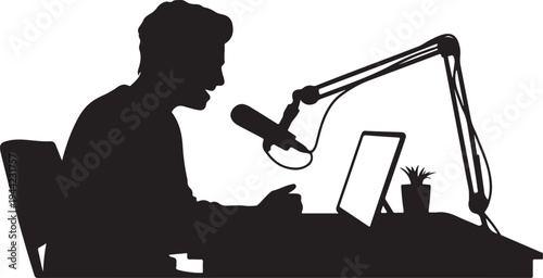 Silhouette of man speaking into microphone at desk