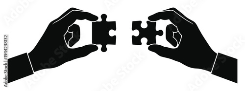 Black silhouette of two hands holding puzzle pieces, symbolizing connection and problem-solving collaboration
