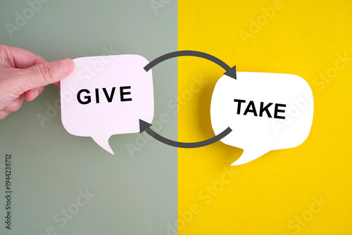 GIVE and TAKE word on real white speech bubble paper cut transfer arrow on green and yellow background,  Business give , charity, knowhow concept