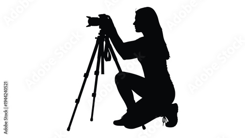 A silhouette of a female photographer at work capturing moments with precision and creativity
