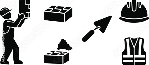 Construction worker building with bricks and safety gear