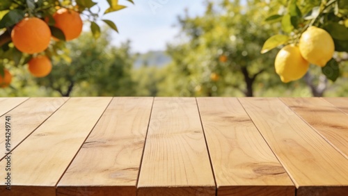 A wooden table in an orchard with ripe oranges and lemons hanging from trees. The scene is bright and sunny, showcasing fresh fruits and natural beauty.