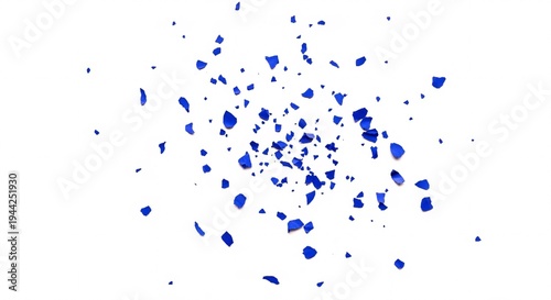 Explosion of blue confetti on white surface, dynamic party element