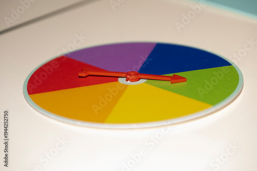 Colorful game wheel with arrow pointer