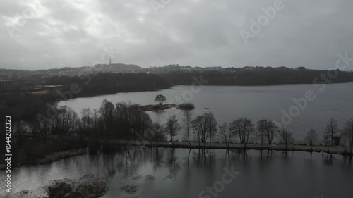 Wallpaper Mural Aerial drone footage showing a suburban area during gloomy midday conditions. The scene features residential houses, streets, and surrounding infrastructure under overcast skies and diffused daylight, Torontodigital.ca