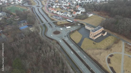 Wallpaper Mural Aerial drone footage showing a suburban area during gloomy midday conditions. The scene features residential houses, streets, and surrounding infrastructure under overcast skies and diffused daylight, Torontodigital.ca