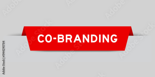 Red color inserted label with word co branding on gray background
