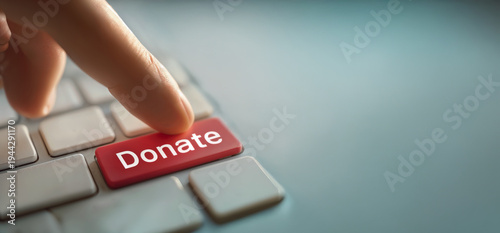 Donate Blood Conceptual Image with Finger Pressing Red Donate Key on