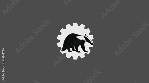 A black and white stylized image features a badger inside a gear on a gray background