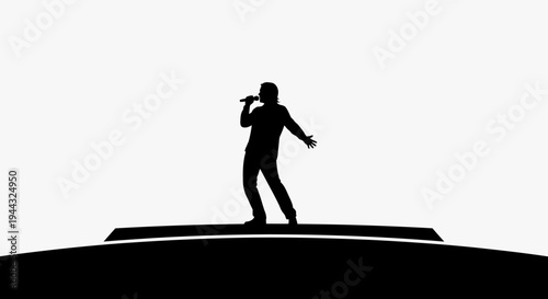 Silhouette of a man singing.