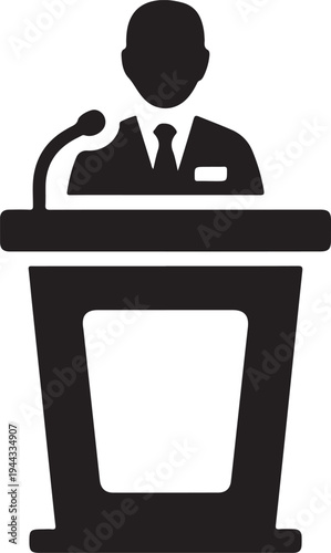 A speaker stands at a podium delivering a presentation a dark silhouette