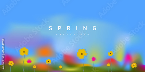 Spring landscape blurred background with bright soft flowers, blue sky and green grass. Fresh natural backdrop for banners, websites, presentations and seasonal design.