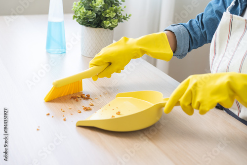 Foto Household clean up, housekeeper asian young woman wearing protection rubber yell