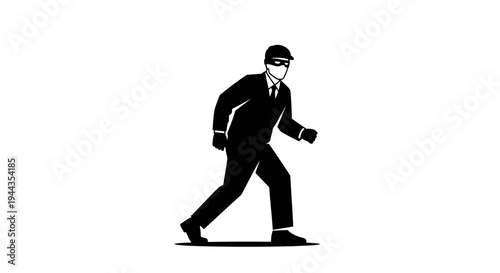 Burglar in Black Suit and Mask Sneaking Stealthily in Dark Silhouette