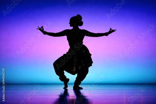 silhouette of a classical dancer performing in a theatre