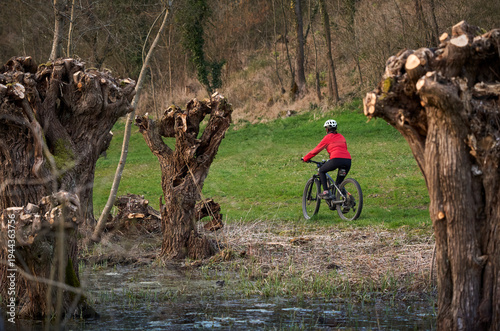 Active senior woman cycling...
