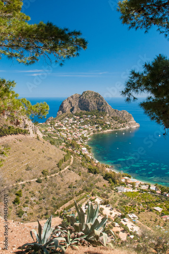 Cape Zafferano seen through some pine trees from the archaeological area Solunto, near Palermo