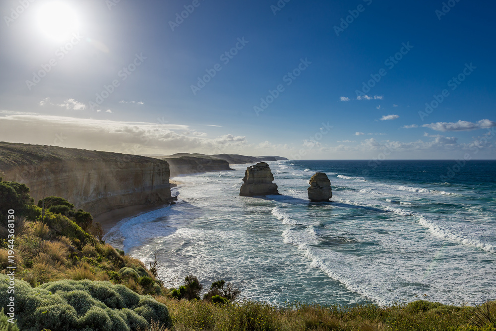 Obraz premium Breathtaking sight of the Twelve Apostles rock formations against the ocean, showcasing nature’s artistry along the Great Ocean Road in Victoria.