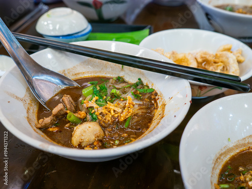 Canvastavla Traditional Thai boat noodles with thick spicy pork broth, meatballs, and liver