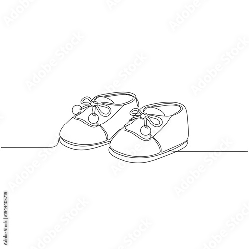 Single line art of cute baby booties with pompom details front view for baby shower greeting cards nursery decor and early childhood development concept