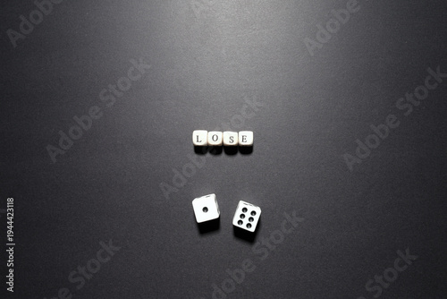 Bild auf Leinwand Lose word above dice symbolizing financial loss, failure, and unsuccessful outcomes