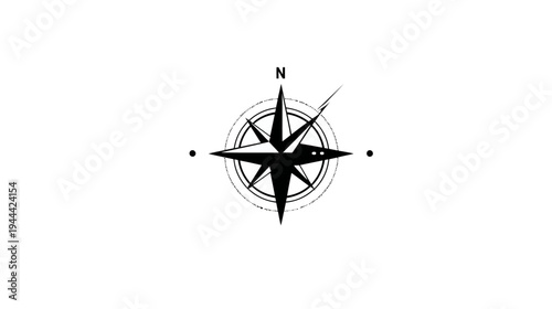 A simple, black compass rose graphic with a clear "N" for north and two dots