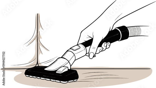 Hand operating vacuum cleaner on floor beside furniture