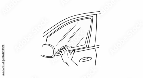 Hand wiping a car window with a cloth