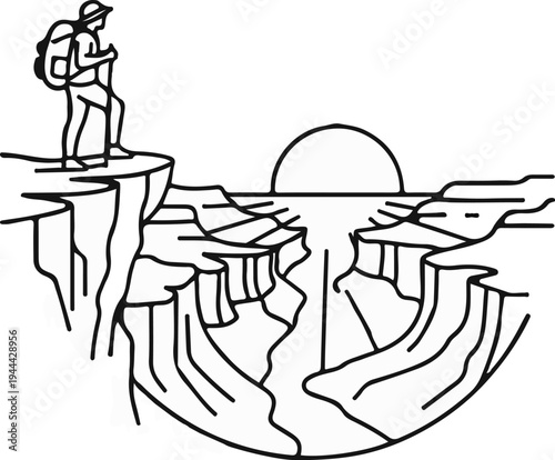 Hiker on cliff edge overlooks vast canyon with setting sun