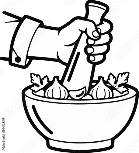 Hand grinding garlic and herbs in a mortar and pestle