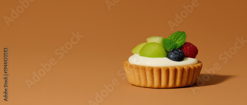 Fresh fruit tart with grape, blueberry, raspberry, and mint leaf on creamy filling, minimal style close up of healthy sweet treat on brown background