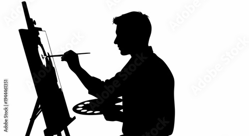 Silhouette of an artist painting on an easel with a brush and palette.