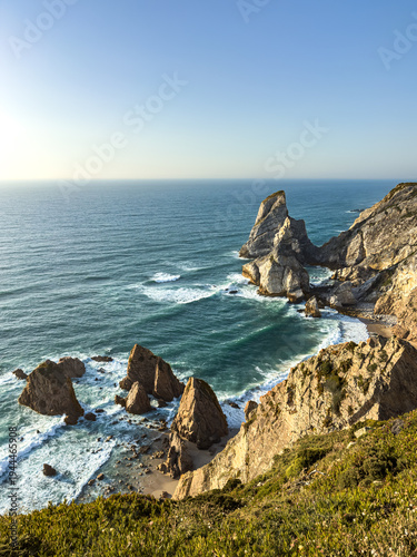 Stunning view of Praia da Ursa rugged cliffs and Atlantic waves near Lisbon, perfect for travel inspiration, nature backgrounds, or Portugal tourism promotion.