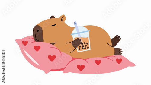 A happy capybara rests on a pink heart pillow with a bubble tea