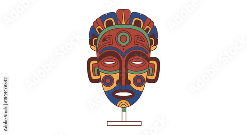 A vibrant colorful tribal mask sits on a stand indoors.