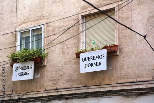 Protests against tourist apartment rentals noise in Alicante, Spain. Queremos dormir means we want to sleep.
