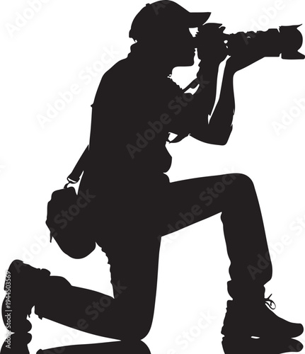 Photographer kneeling and capturing a moment with a professional camera.