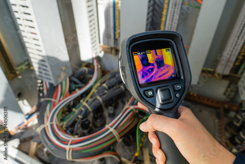 Принти на полотні Thermal camera supports electrical safety inspection inside a control cabinet, revealing heat anomalies in cable connections and wiring to improve reliability, diagnostics, and maintenance