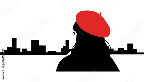 A woman silhouette wearing a red beret against city skyline